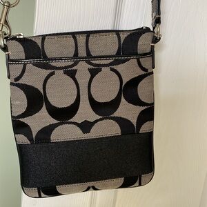 Coach like new , black patterned cross bay.